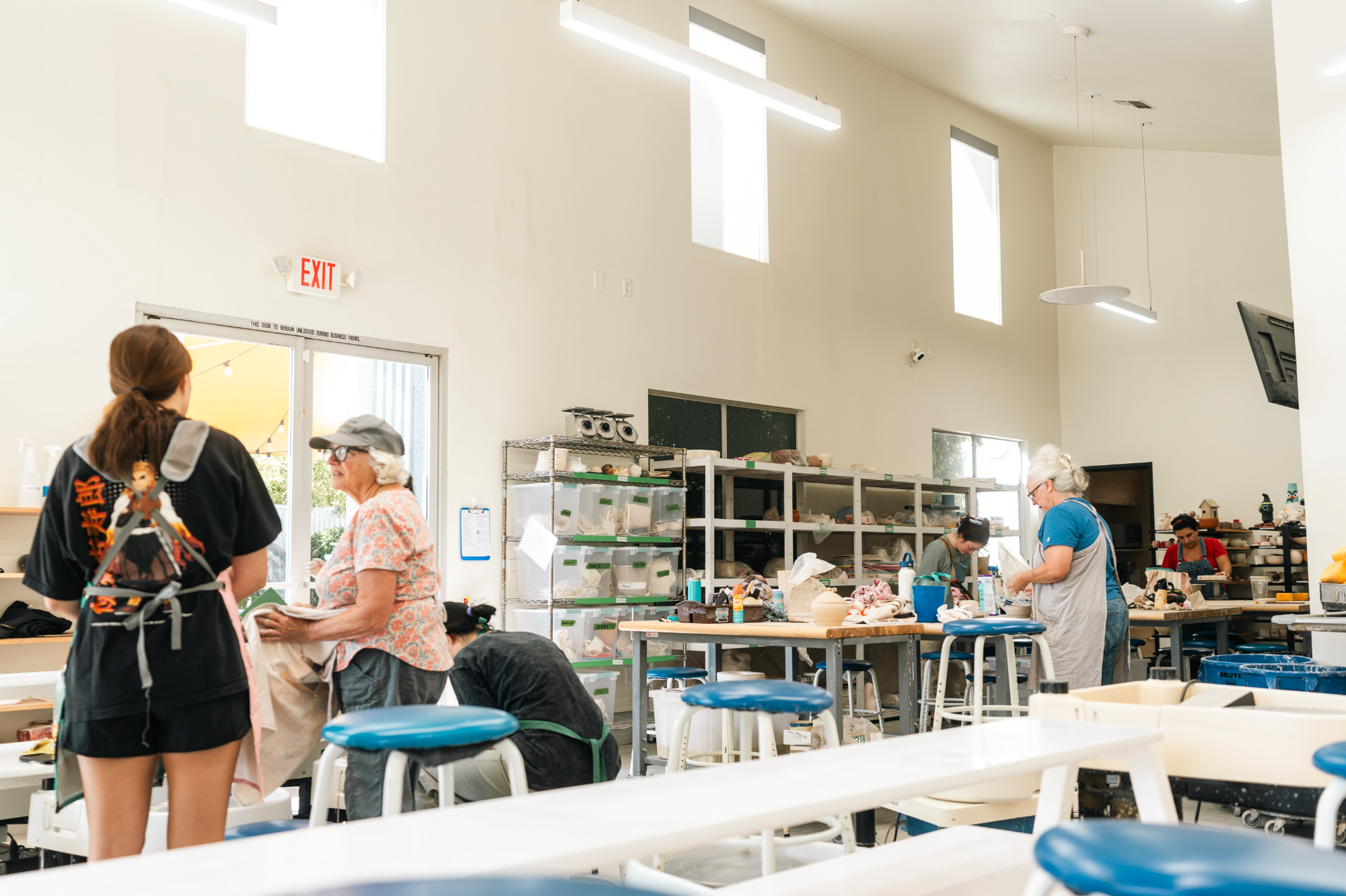 Students at the hand-building tables in the main studio