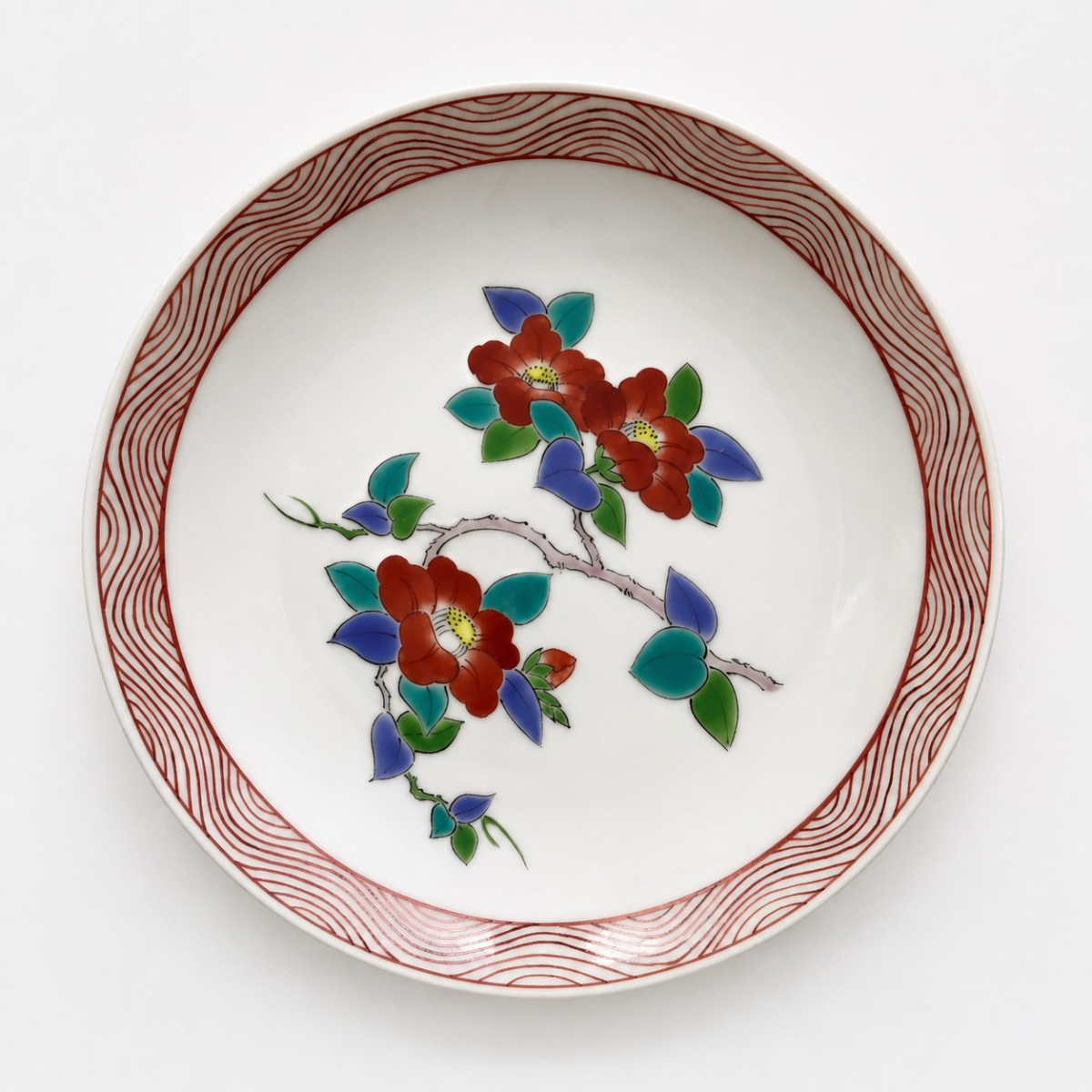 Nabeshima plate with red camellias and a combed red border