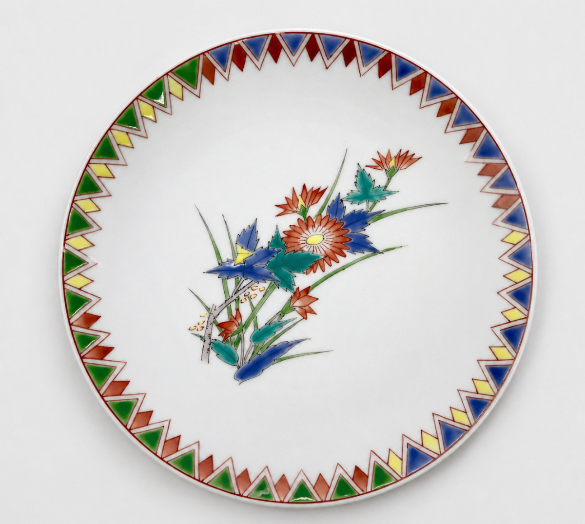Nabeshima plate with red chrysanthemums and a sawtooth border